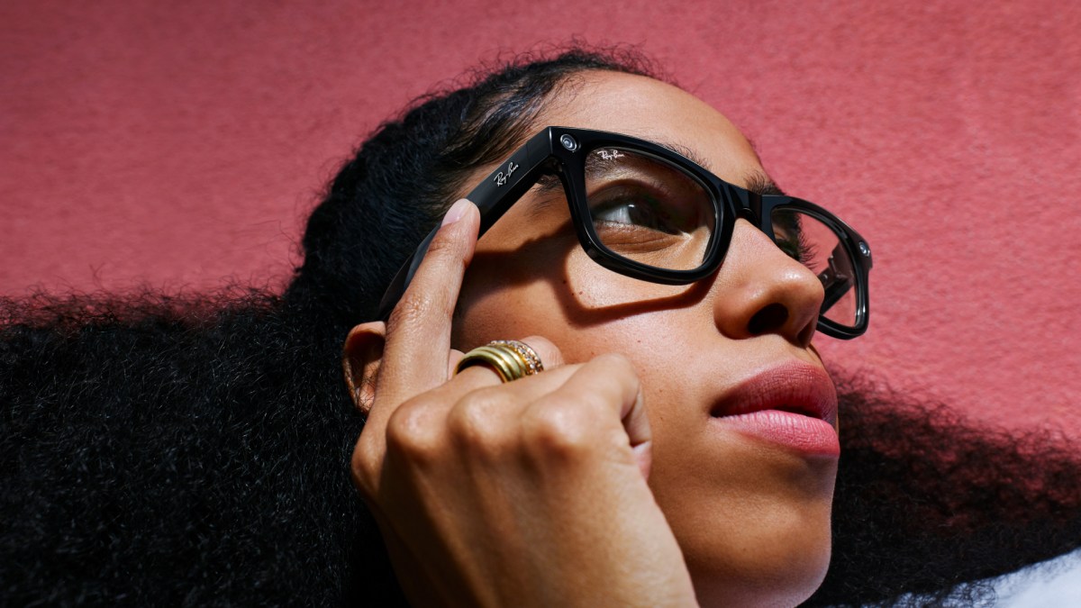 A person wearing Ray-Ban Meta Gen 1 smart glasses